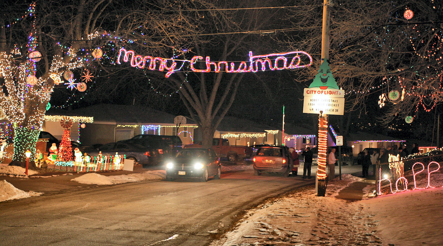 Several homeowners along Wood River Drive, near 51st and Harrison streets, cover their yards and homes in Christmas lights.